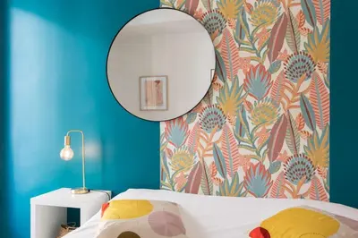 a bedroom with a blue wall with a mirror and a bed at #10 2Pièces Fricéro 3min to the beach/Balcon & AC in Nice