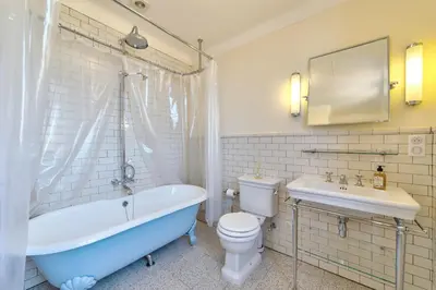 a bathroom with a tub and a toilet and a sink at Villa Francesca Beautiful villa with sea view and swimming pool! in Villefranche-sur-Mer