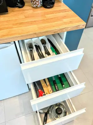a kitchen drawer filled with cooking tools under a counter at Cozy T2 - Lovely Balcony - Center - Liberation - Clim - WIFI in Nice