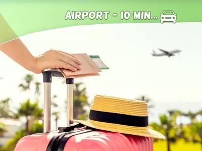 a person with a hat on top of a suitcase at Cozy T2 - Lovely Balcony - Center - Liberation - Clim - WIFI in Nice