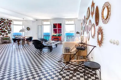 a living room with a table and chairs at L50 2P Rauba Capeu SEA View IloveNice Balcony&AC in Nice