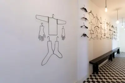 a room with a wall with shoes on the wall at L50 2P Rauba Capeu SEA View IloveNice Balcony&AC in Nice