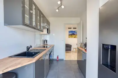 a kitchen with a sink and a counter top at L43 Suite Maurice sea view 6Pax/Terrace,Parking,AC in Saint-Laurent-du-Var