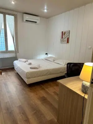a bedroom with a bed and a desk in it at MY CASA - BOSIO RAOUL - Central few steps to the sea in Nice