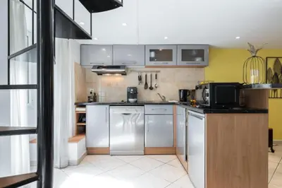 a kitchen with stainless steel appliances in a room at MY CASA - MASSENA 2 - Great location Massena Square with AC in Nice