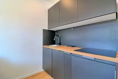 a kitchen with a sink and a counter top at Accès direct Promenade Des Anglais - Negresco in Nice