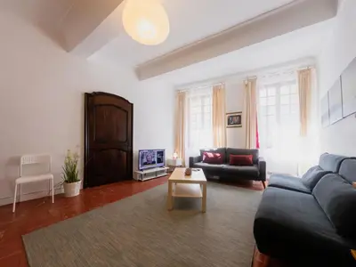 a living room with a couch and a table at Old Town- 4 Pers, Vieux Nice, AC, wifi in Nice