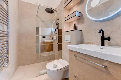 a bedroom with two bunk beds and a stone wall at Vieille Ville - 5 pers, AC, WIFI in Nice