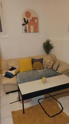 a living room with a couch and a coffee table at BEACH APPART in Nice