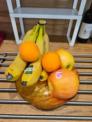 a bunch of bananas and oranges on a table at Boutique Studio 2 in Nice