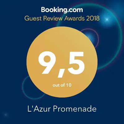 a sign that reads quest review awards with a yellow circle at L'Azur Promenade in Nice