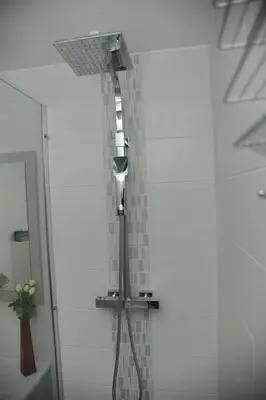 a shower in the corner of a bathroom at L'Azur Promenade in Nice