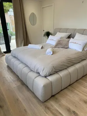 a large bed in a room with a large bed sqor at Luxury Villa with Pool & Sea View-10 Minutes from Monaco in Èze
