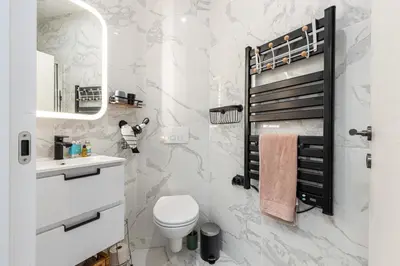 a white bathroom with a toilet and a sink at MY CASA - FOCH - Superb Suite w AC Downtown in Nice