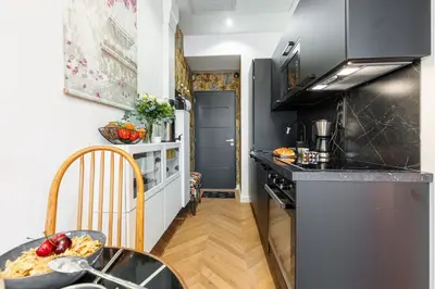 a kitchen with a table and a counter top at MY CASA - FOCH - Superb Suite w AC Downtown in Nice