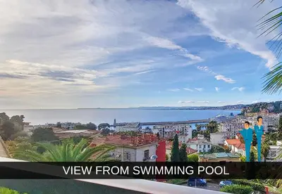 a view of the city and the ocean from swimming pool at Nestor&Jeeves - HUBLOT TERRASSE - Sea view - swimming pool in Nice