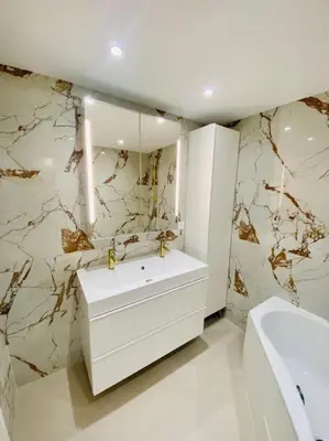 a bathroom with a white sink and a mirror at T3 duplex cosy & calme au port - Tram in Nice