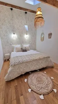 a bedroom with a bed and a rug on the floor at T3 duplex cosy & calme au port - Tram in Nice