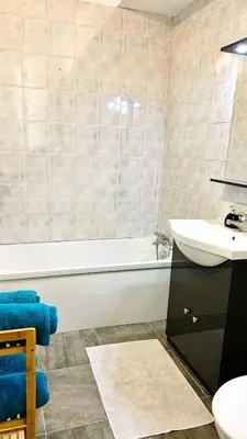a bathroom with a white tub and a sink at Studio calme Nice hyper centre in Nice