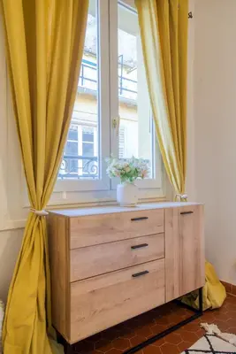 a bedroom with a large bed with pillows on it at Cosy, modern, fully equipped, air conditioning, Nice historical, old town, 1minute walk from beach - 