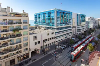 an overhead view of a city with buses and buildings at L28 Suite Californie 1min walk sea 3BDR/ AC & balcony in Nice