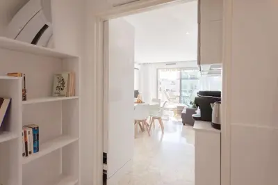 a living room with a door open to a living room at L28 Suite Californie 1min walk sea 3BDR/ AC & balcony in Nice