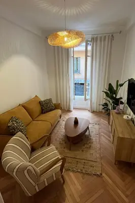 a living room with a couch and a table at CHEZ TAMARA in Nice