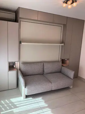 a living room with a couch in a room at Studios Nice Gambetta in Nice