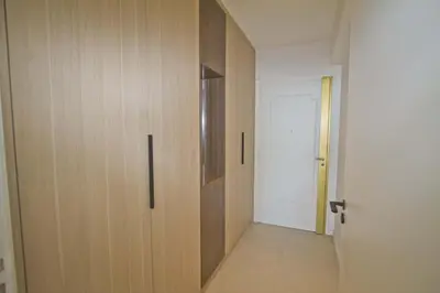 a hallway with a wooden door in a room at Sea Front Palace Promenade in Nice