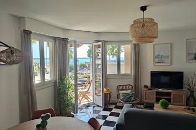 a living room with a view of the ocean at Beautiful flat with balcony and sea view in Saint-Laurent-du-Var