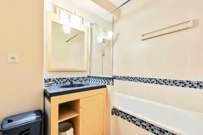 a bathroom with a sink and a bath tub at Résidence Héliotel Marine - maeva Home - Studio 4 personnes - Confort MAE-5084 in Cros-de-Cagnes