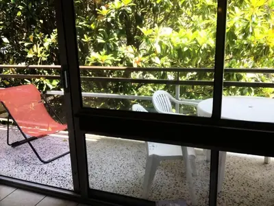 a view of a balcony with a table and a chair at Résidence Héliotel Marine - maeva Home - Studio 4 personnes - Confort MAE-5084 in Cros-de-Cagnes