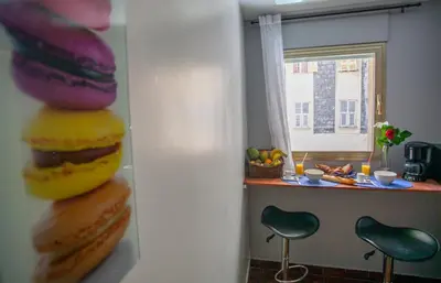 a kitchen with a table with a bunch of food at Appartement 3 pièces SoNice au centre de Nice in Nice