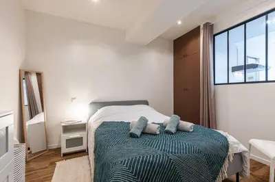a bedroom with a bed and a large window at MY CASA - MARI 71 - Unique Apt Near Sea in Nice