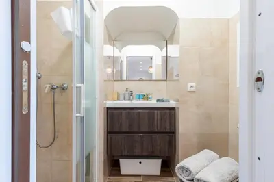 a bathroom with a sink and a shower with a mirror at MY CASA - MARI 71 - Unique Apt Near Sea in Nice