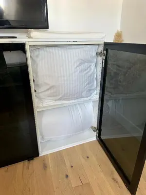 an empty refrigerator with its door open in a room at Beau studio au cœur de Nice in Nice
