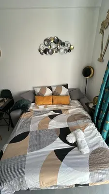 a bed in a room with two beds at Studio NICE CENTRE sur Avenue Jean Medecin MER à 8 minutes de marche in Nice