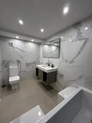 a bathroom with a toilet and a sink and a mirror at Èze - Appartement dans bas de villa avec piscine près de Monaco in Èze