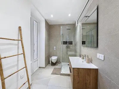 a bathroom with a sink and a shower and a toilet at Le Francis - Riquier Port de Nice in Nice