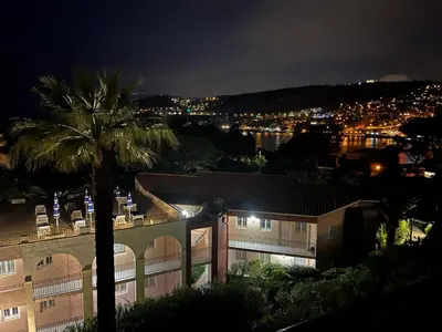 a view of a building at night at Pool , 150m to beach, seaview in Villefranche-sur-Mer