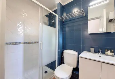 a bathroom with a toilet and a shower and a sink at Nestor&Jeeves - TERRACOTTA - Premium location, close sea in Nice