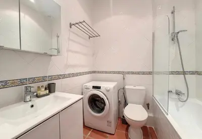 a white bathroom with a washing machine and a sink at Nestor&Jeeves - TERRACOTTA - Premium location, close sea in Nice