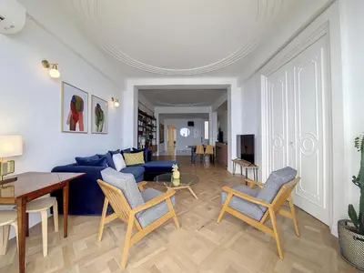 a living room with a blue couch and chairs at Nestor&Jeeves - MEDITERRANEE PROMENADE - Vue Mer in Nice