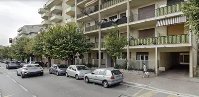 a row of cars parked in front of a building at Escapades Ensoleillées in Nice