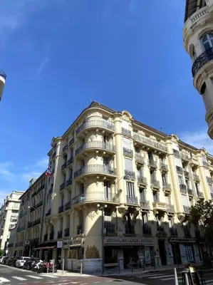 a large building on the corner of a street at Heart of Nice-Rooftop Seaside Studio in Nice