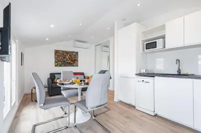 a kitchen and dining room with a table and chairs at MY CASA - SPITALIERI 2 - Superb Terrace Panoramic View AC in Nice