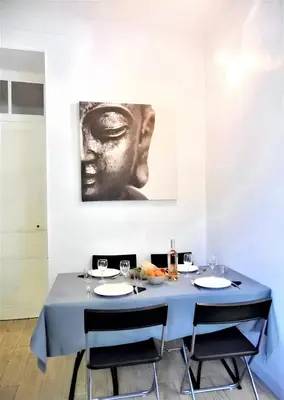 an open door into a hallway with a floor at Appartement confortable au cœur de Nice - Vue sur la ville in Nice