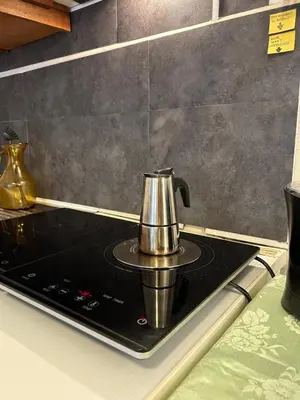 a coffee pot on top of a stove in a kitchen at Studio lumineux avec balcon à proximité de la mer in Nice