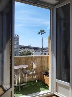 a view of a balcony with a table and chairs at Nice Centre STUDIO avec BALCON in Nice