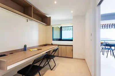 a home office with a desk and chairs at Agrianthe Palmiers AP4380 By Riviera Holiday Homes in Villefranche-sur-Mer